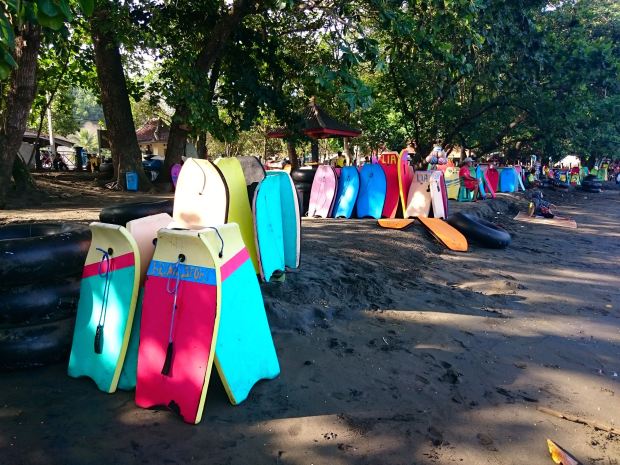 Colourful boards at Batu Karas shore